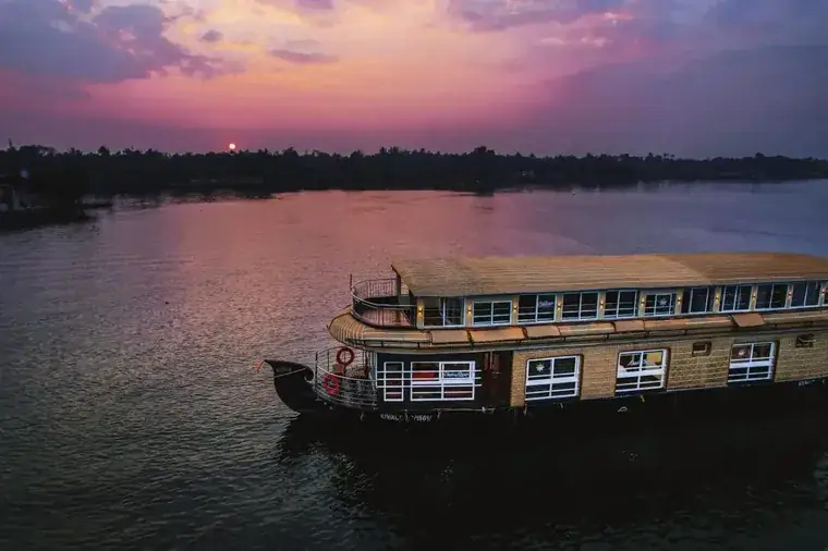 Houseboat at sunset on the Alleppey backwaters